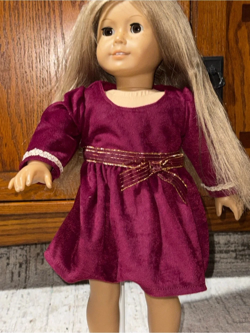18” doll maroon Velvet dress with gold bow sash around waist